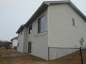Back view with fenced back yard