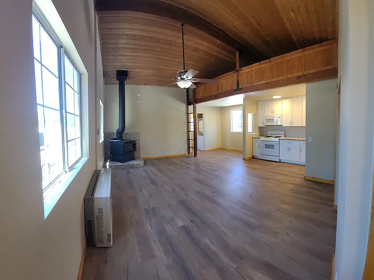 Open concept, living room, kitchen and dining area.