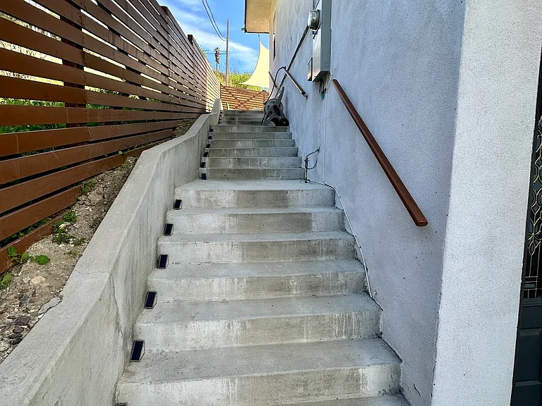 Outside stairs to backyard with solar lights