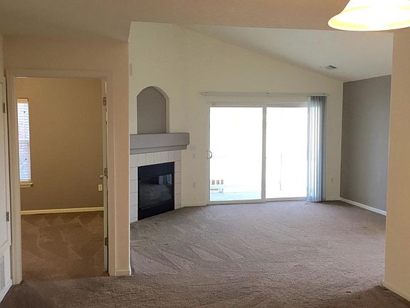 Eating area overlooking the living room with vaulted ceilings