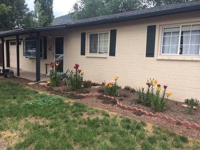 Front of house with bulbs in the flower bed