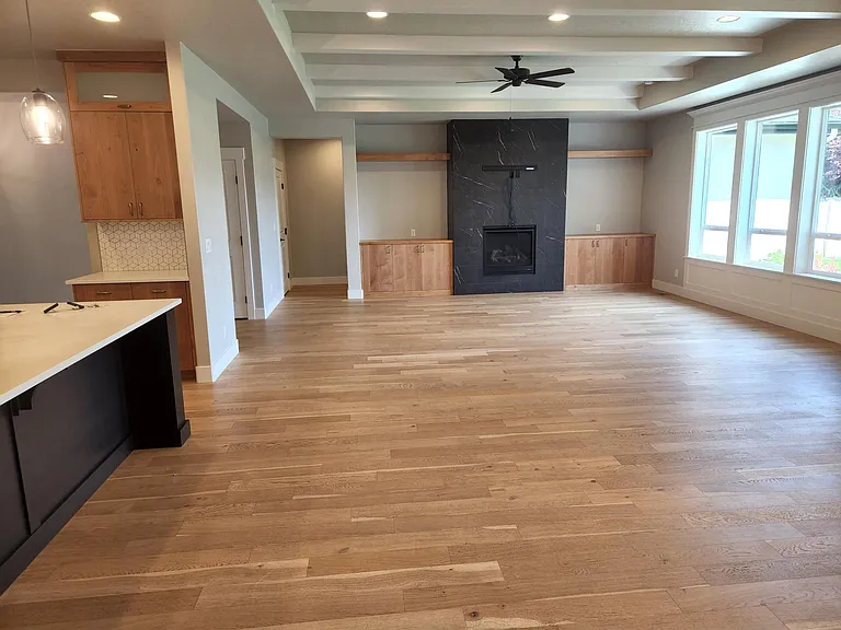 Floor to ceiling fireplace and beamed ceiling