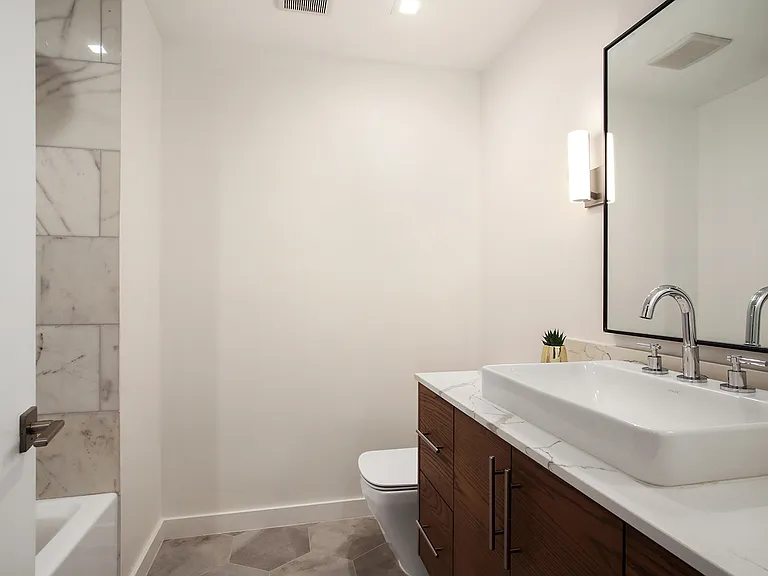 There is a full bathroom on the second floor of the condo.