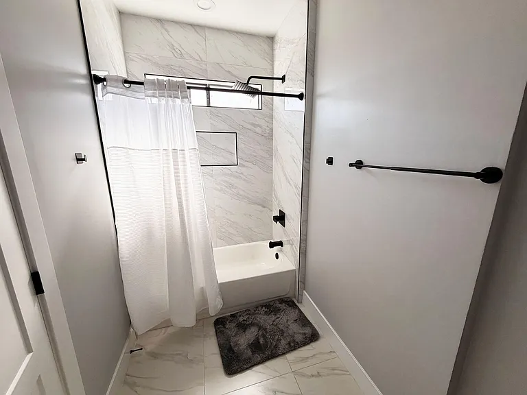 Private bathroom with tub/shower and rain fall shower head