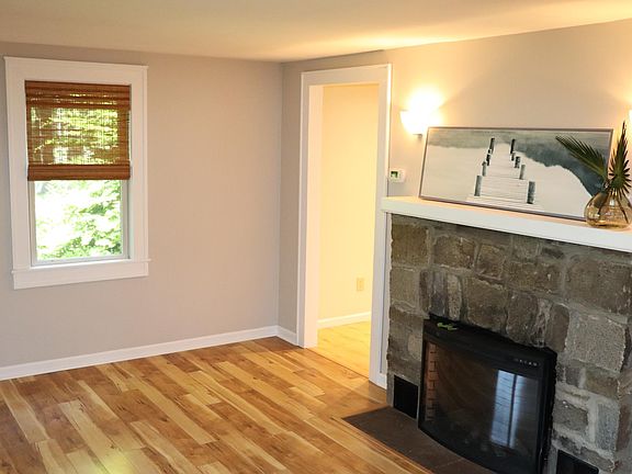 From the living room to the kitchen to the left of the fireplace-bathroom and bedrooms to the right.