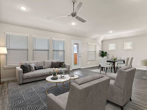 Living room in the Emmy II home plan by Trophy Signature Homes - REPRESENTATIVE PHOTO