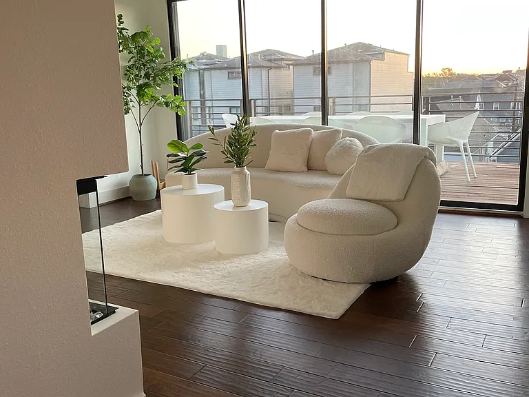 4th level living area with large sliding glass doors that open to huge rooftop deck overlooking vibrant Heights neighborhood