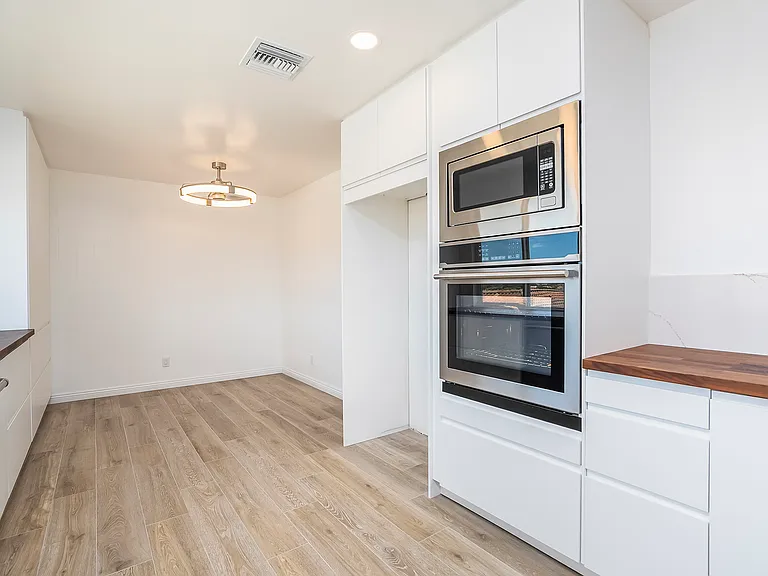 LED light and incorporated ceiling fan hover over the kitchen table. Space for your own refrigerator or one will be provided.