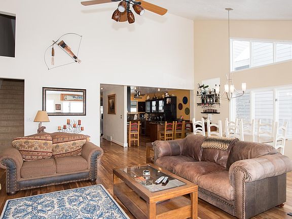 Living room with overstuffed leather sofa and love seat.