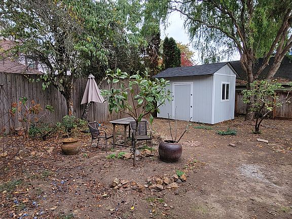 plum trees. 10' x 20' shed.