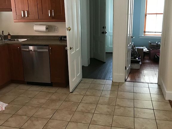 kitchen, hall to upstairs (washer and dryer and back stairs door are here), bedroom door