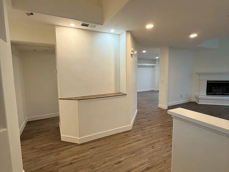 Inviting entry with a clean, modern door and sleek hardware for a polished first impression. New recessed lights give warm inviting look.
