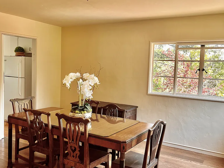 Dining room opens up to the kitchen or can be closed off, beautiful full sun with surrounding windows.