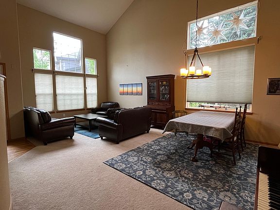 Dining and sitting room with 18ft ceilings