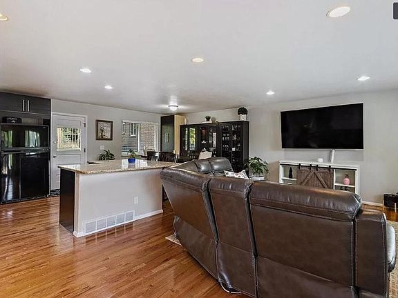 hardwood floors, updated kitchen with modern appliences, new light grey modern paint inside