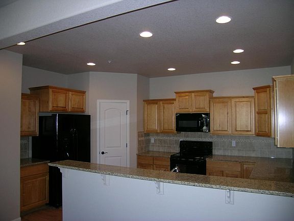 Granite countertops, cityscape maple cabinets