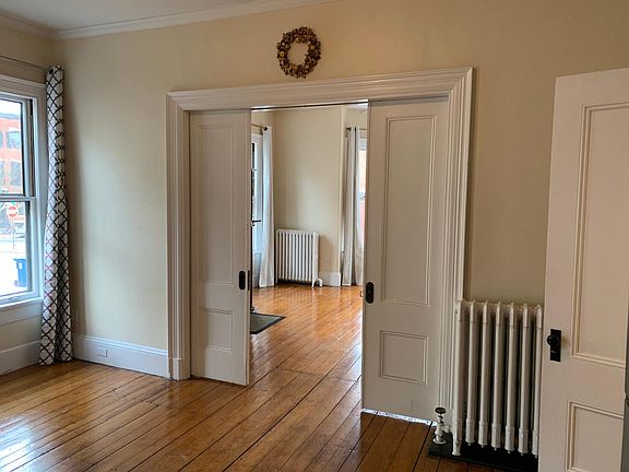 Kitchen looking into the living room, the french doors are 1/2 drawn.