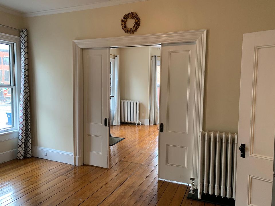 Kitchen looking into the living room, the french doors are 1/2 drawn.