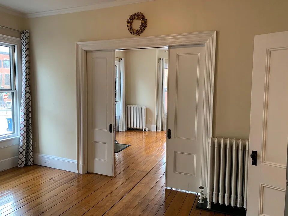 Kitchen looking into the living room, the french doors are 1/2 drawn.