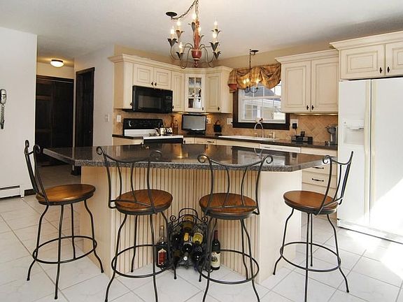 Wonderfully updated kitchen with granite
        counters
