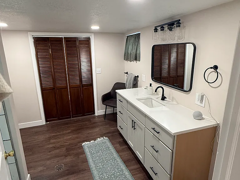 New lower level bathroom with large shower and vanity.