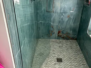 Master bathroom - marble floor tiles in shower