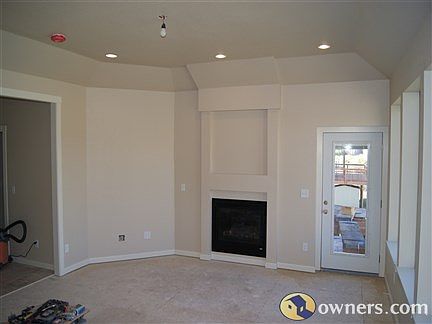 Living room showing gas fireplace.  Door at right goes to deck.