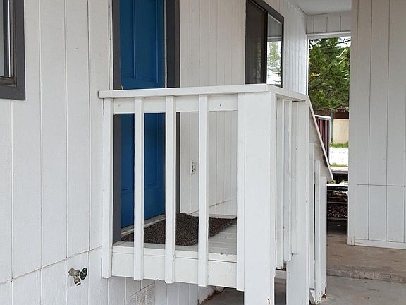 Door from carport to kitchen area.