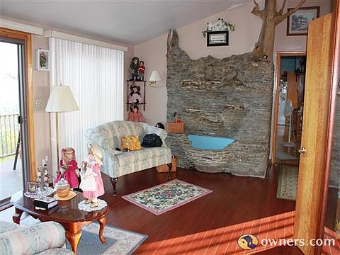 Sitting room, with rock wall and water fall.