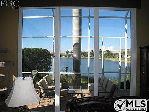 Custom sliding rear door (hurricane proof) sliding doors opens entire house to cool lake breezes. Gr