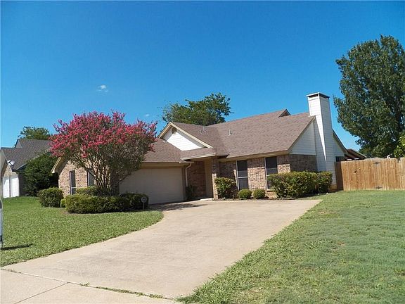Garage is in front, side gate beside chimney