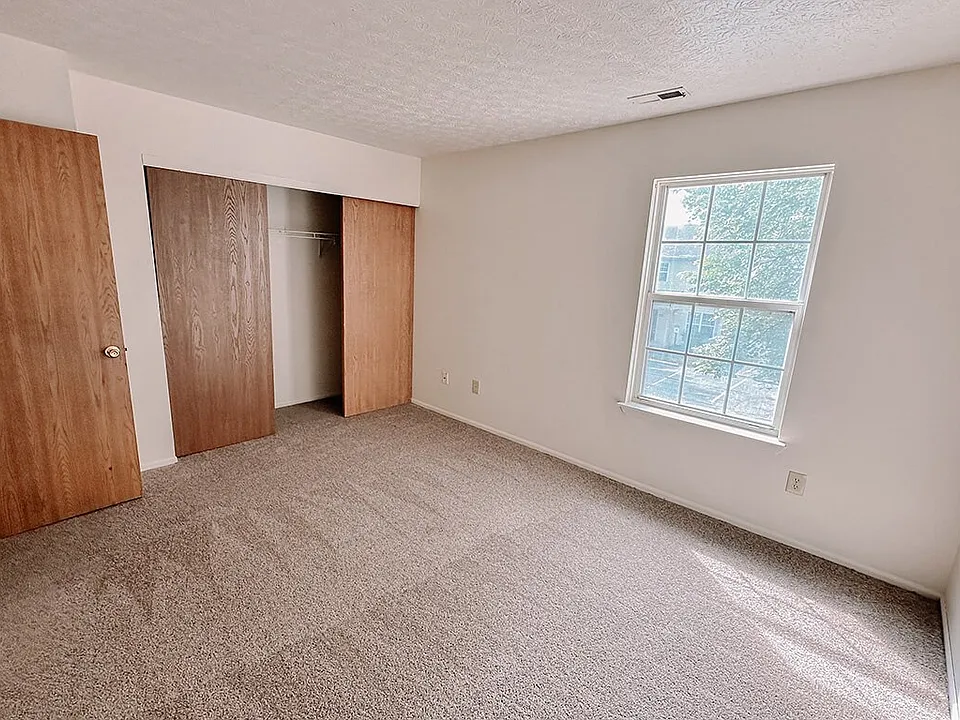 Bedroom with Window and Closet