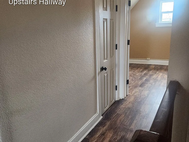 Upstairs hallway looking into 3rd bd room