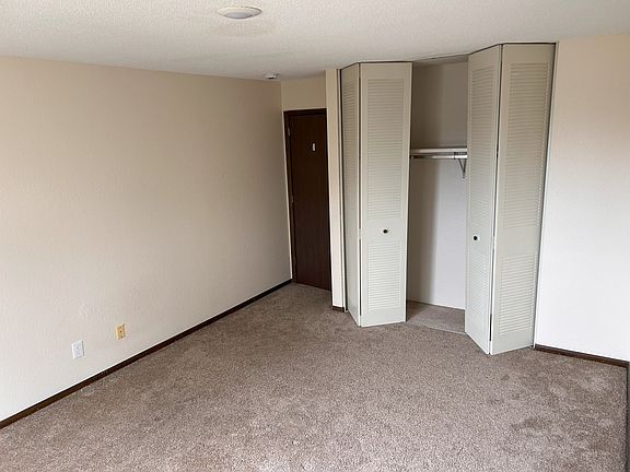 The bedroom offers a large, private space with a huge closet.