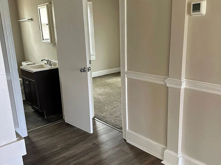 Hall Area Leading into 3 Bedrooms / 1 Angle