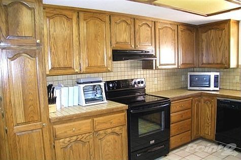 The kitchen features a new range/oven,