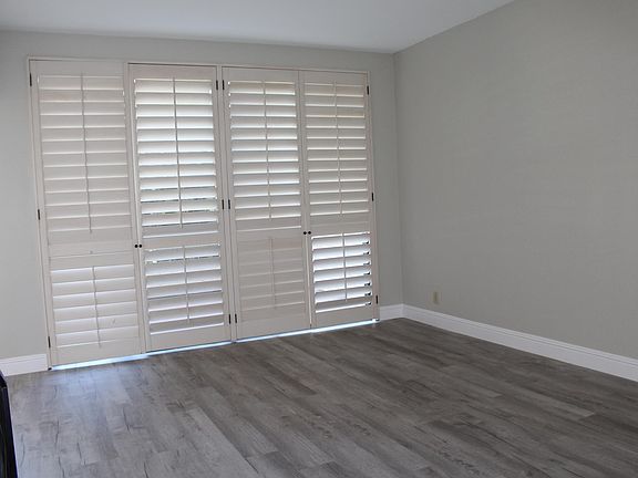 Family room w/sliding glass doors leading to a private balcony.