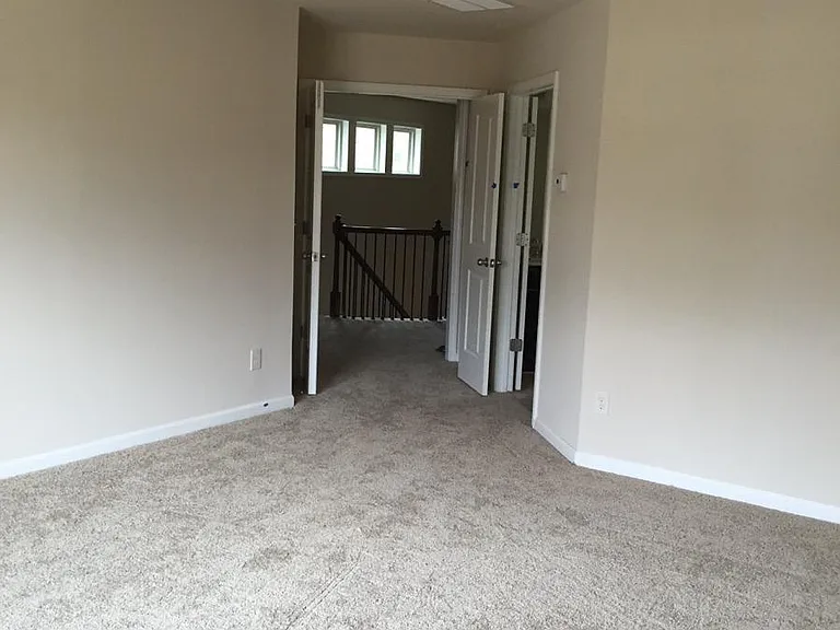 Master room with double doors and Ceiling fan
