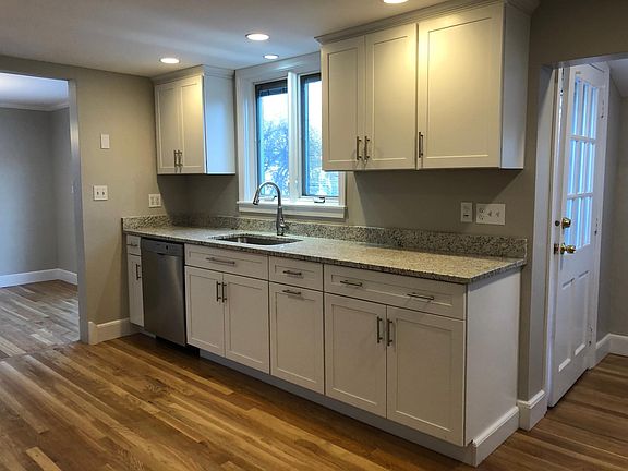 Modern kitchen, recessed lighting and large capacity dishwasher.