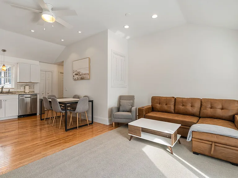 Open Concept, Living Area, Dining Area, Stainless Steel Appliances, Dishwasher, Sectional Sofa, Recessed Lighting, Hardwood Floors.