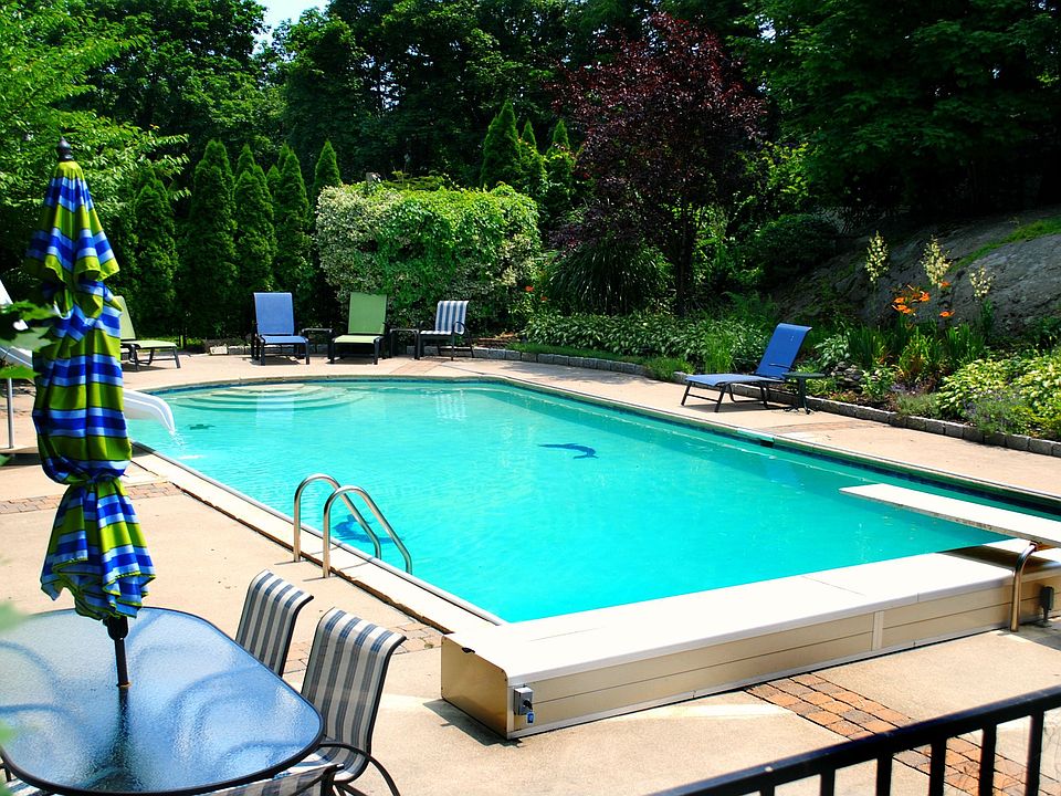 40' x 20' Gunite pool with an automated retractable cover nestled in beautiful