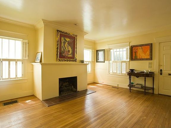The Living Room Is Anchored By A Handsome Fireplace