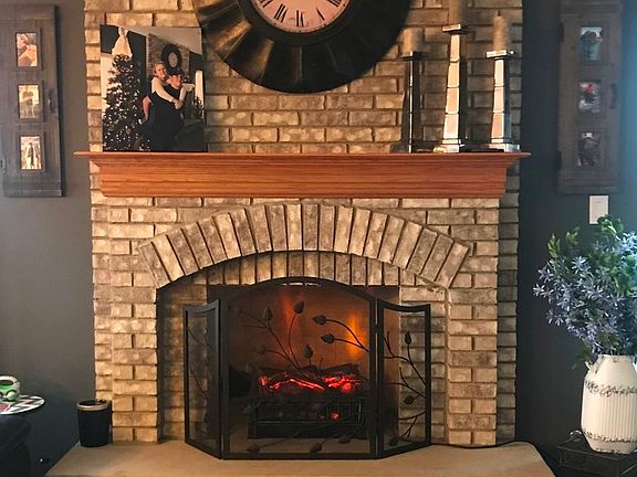 BEAUTIFUL BRICK FIREPLACE WITH GAS STARTER!
