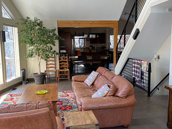 Open Living area into kitchen and pellet stove area