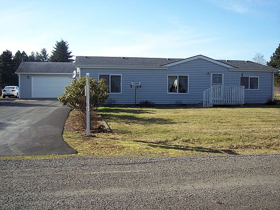 This home sits on a beautiful, flat and dry lot which is over a half acre!