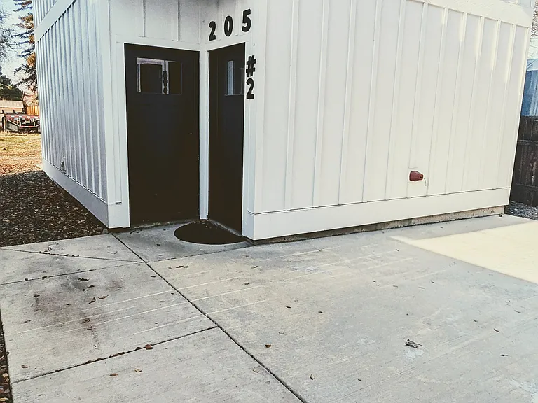 Exterior of The Gorgeous George rental ADU. Located above detached garage, purpose built. Entry door is the righthand door with "#2" next to it.