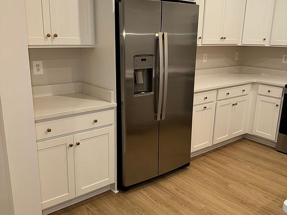 Kitchen, with included appliances (i.e fridge and freezer).