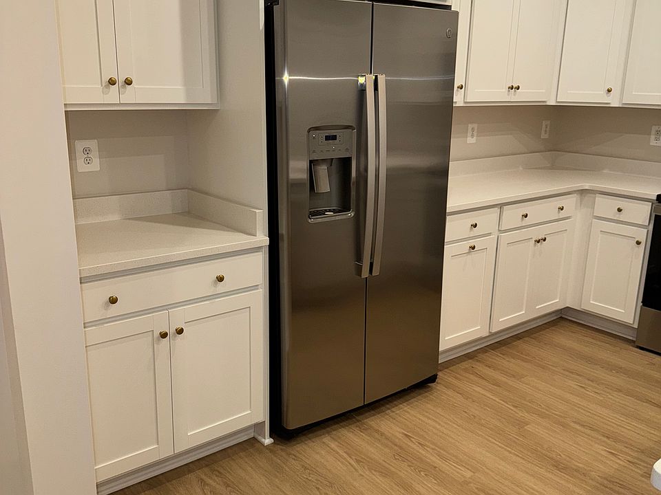 Kitchen, with included appliances (i.e fridge and freezer).