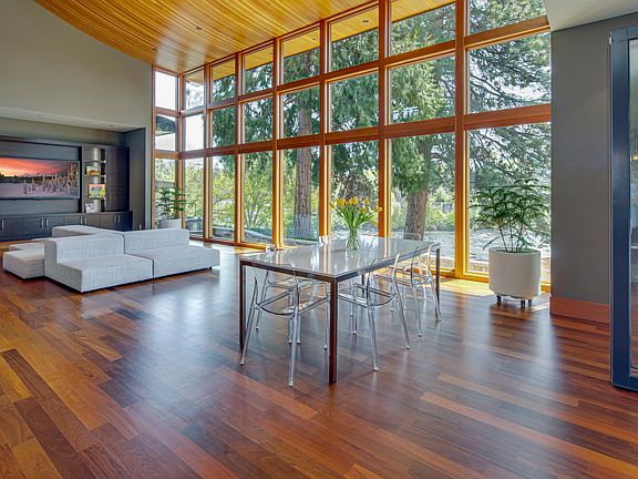 The Great Room for dining and living with nonstop light and river views.