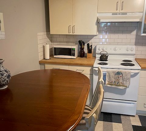 Other kitchen view with breakfast table.